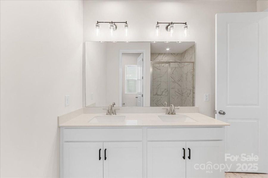Dual Vanity at Primary Bath with Convenient Storage. Dual Vanity at Primary Bath with Convenient Storage.