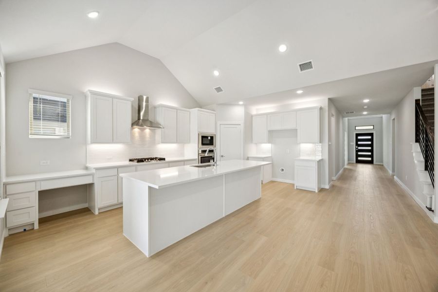 Kitchen in the Wimbledon home plan by Trophy Signature Homes – REPRESENTATIVE PHOTO