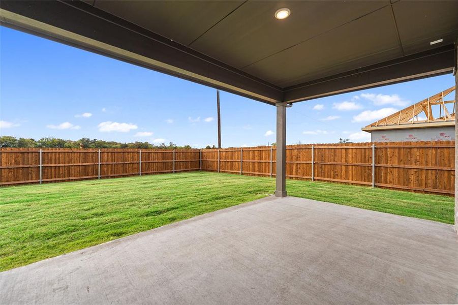 Fenced backyard featuring a patio Fenced backyard featuring a patio