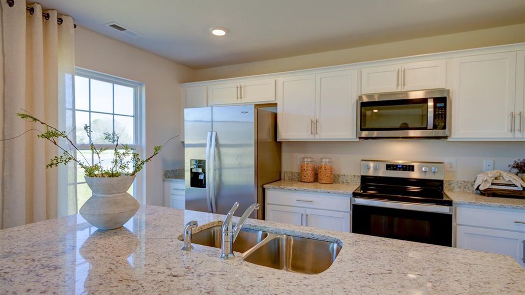 Representative furnished interior of a home built from the Penwell - Express by D.R. Horton in Bynum Farms, Farmville (Image 9).