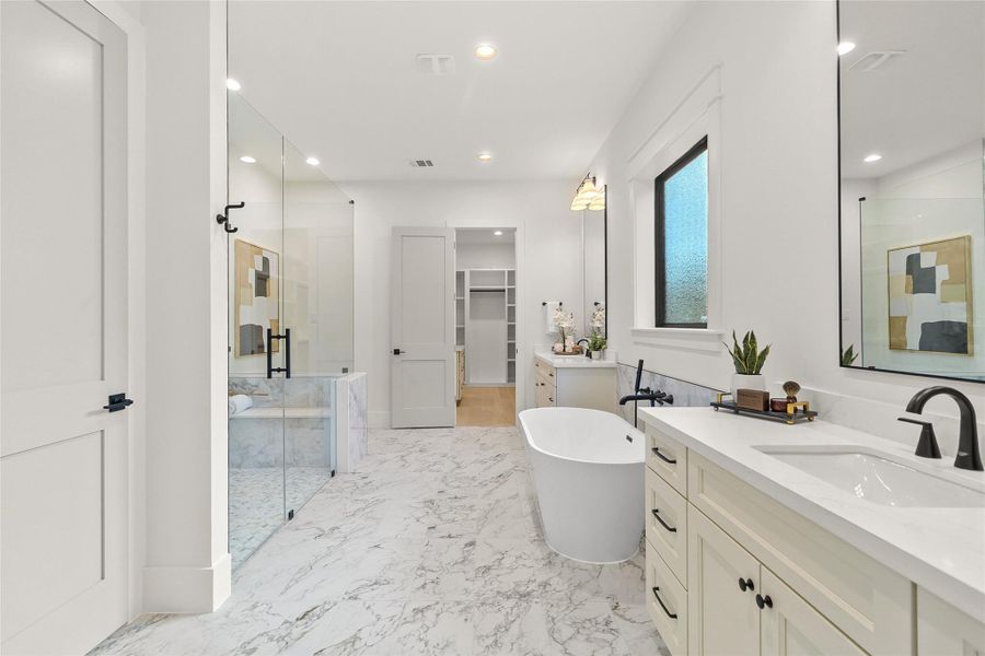 Beginning and ending each day feels like a luxury in your spa-inspired primary bathroom, complete with a soaking tub, oversized walk-in shower, and dual vanities.