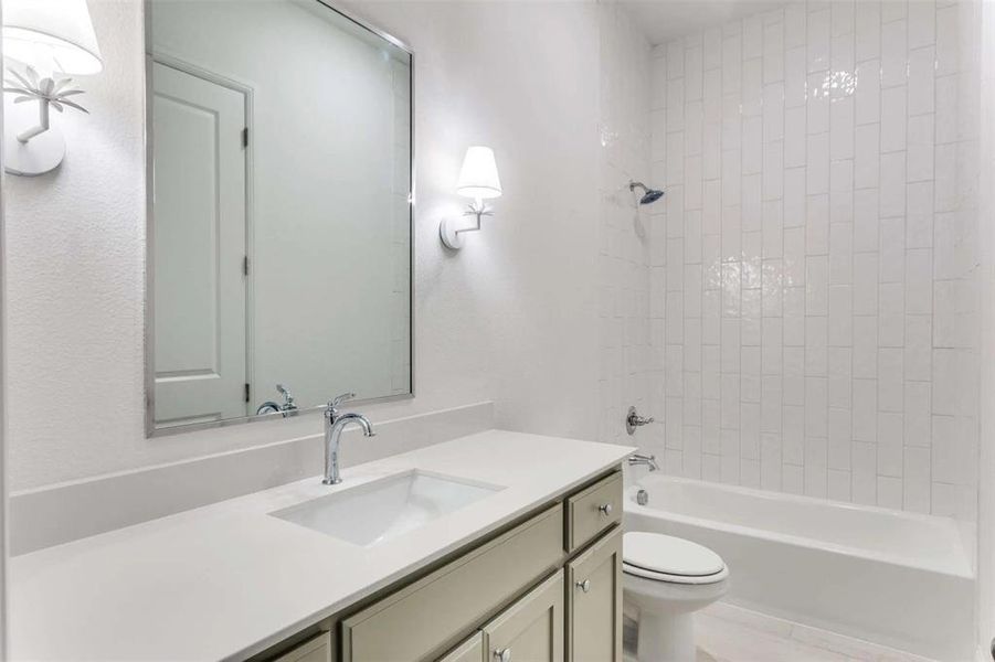 Full bathroom featuring shower / tub combination and vanity