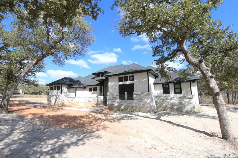 Front exterior of a new home in , La Vernia, TX, highlighting curb appeal (Image 1).