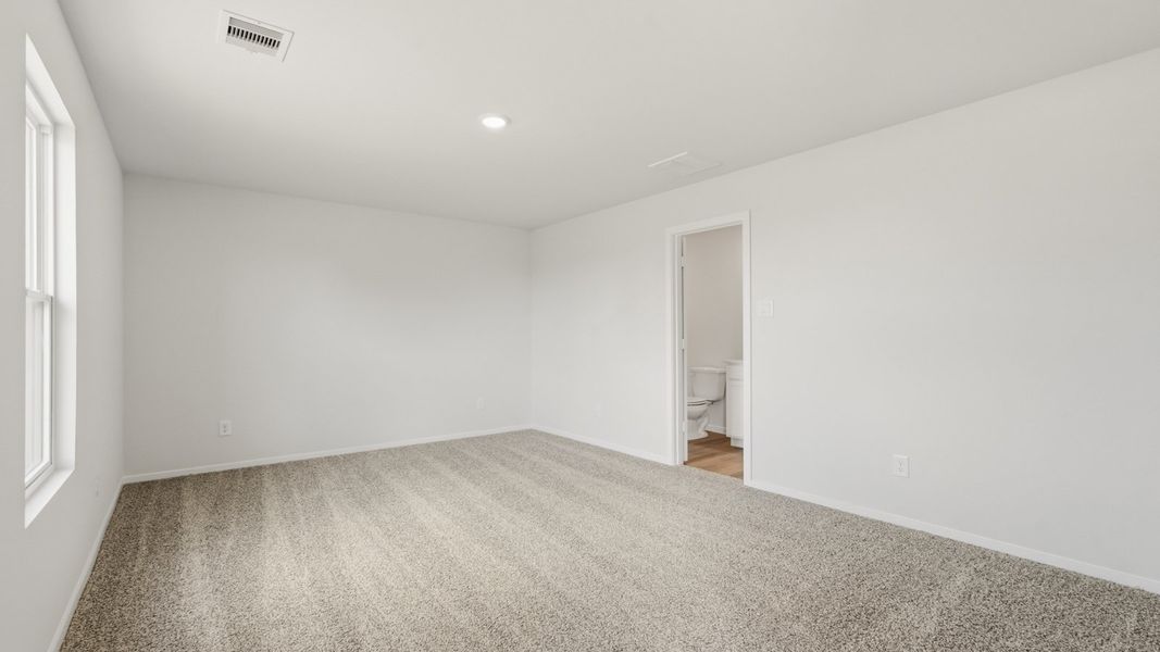 Spacious, unfurnished interior of a new home in Sunterra, Katy (Image 23).
