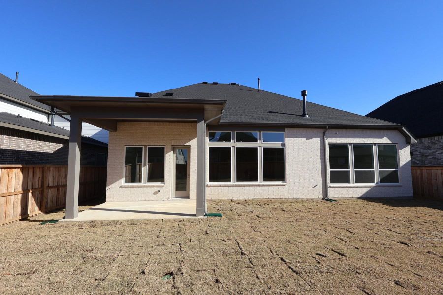 Exterior details and patio area of a home in Dunham Pointe, Cypress (Image 4). Exterior details and patio area of a home in Dunham Pointe, Cypress (Image 4).