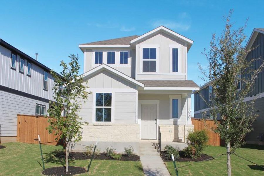 Front exterior of a new home in The Hollows at Avery Centre, Round Rock, TX, highlighting curb appeal (Image 2).