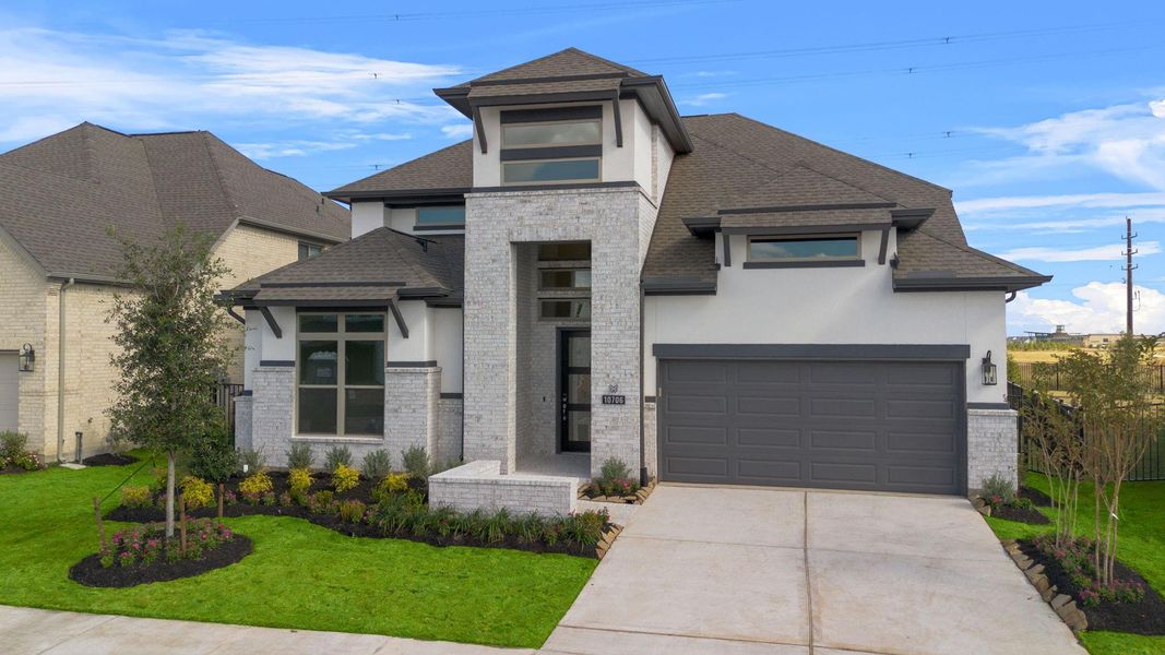 Front exterior of a new home in Bridgeland 55', Cypress, TX, highlighting curb appeal (Image 21).