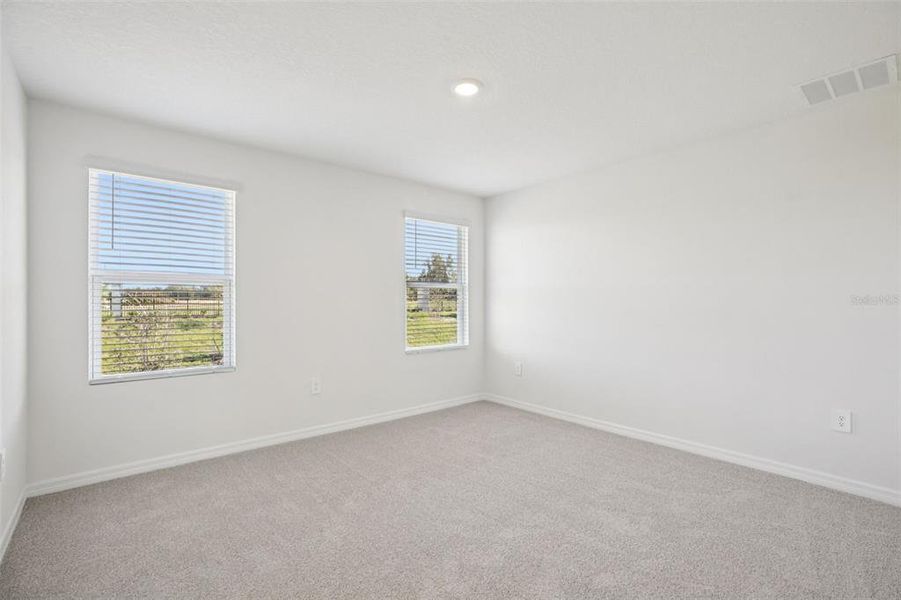 Spacious, unfurnished interior of a new home in The Reserve at Hammock Oaks Townes, Lady Lake (Image 26).