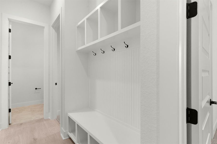 Mudroom featuring light wood-type flooring Mudroom featuring light wood-type flooring