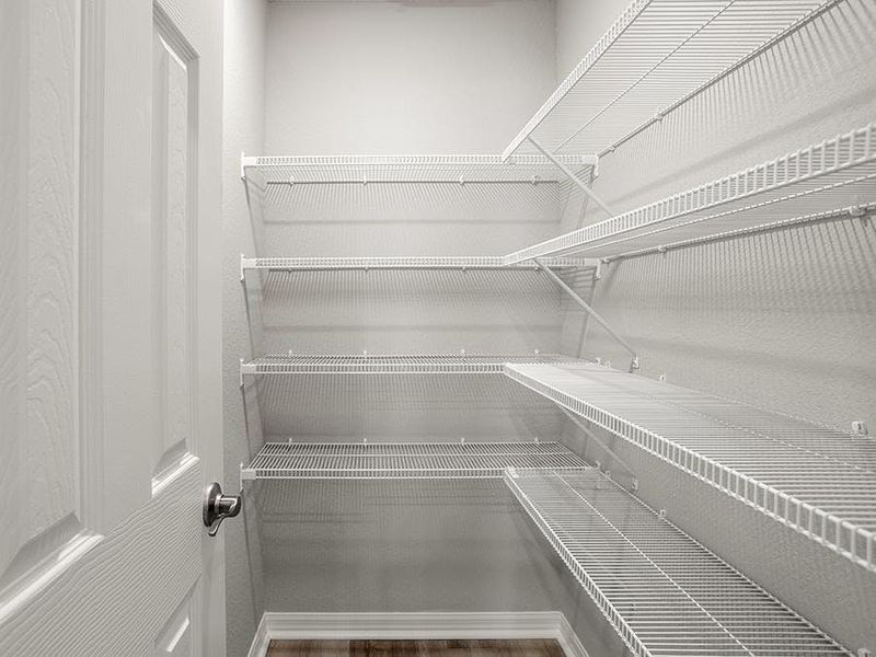A walk-in pantry provides storage convenience - Paisley by Highland Homes