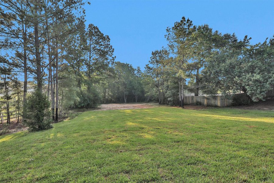 Expansive backyard with partial fencing, ideal for pets, play, or gardening. Expansive backyard with partial fencing, ideal for pets, play, or gardening.