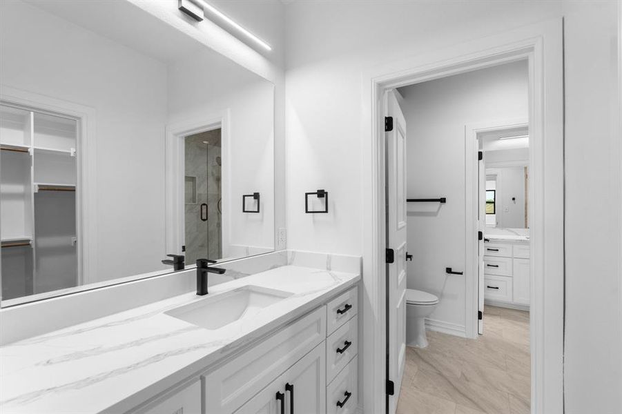 Full bath with vanity and a shower stall Full bath with vanity and a shower stall