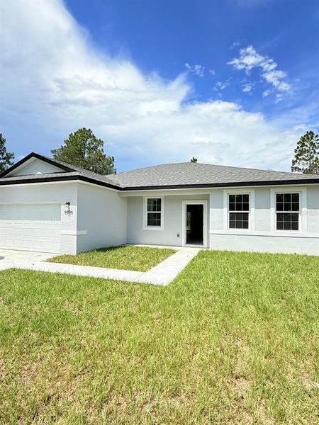 Front exterior of a new home in , Citrus Springs, FL, highlighting curb appeal (Image 2). Front exterior of a new home in , Citrus Springs, FL, highlighting curb appeal (Image 2).
