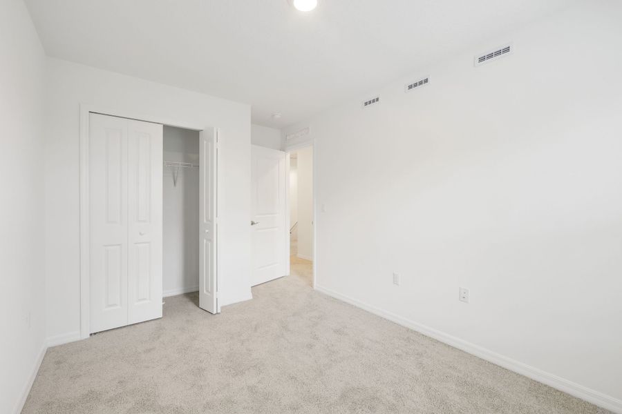 Spacious, unfurnished interior of a new home in Towns at Riverwalk, Sanford (Image 27). Spacious, unfurnished interior of a new home in Towns at Riverwalk, Sanford (Image 27).