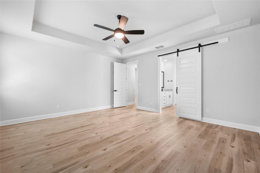 Enter to the Master bath through a beautiful, sliding barn door.