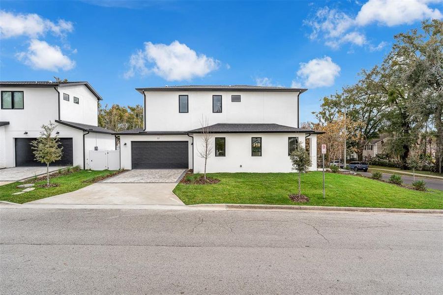 Front exterior of a new home in , Orlando, FL, highlighting curb appeal (Image 26).