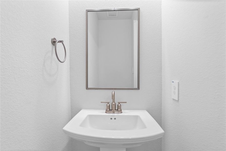 Strategically located on the main level, this half-bath allows guests to freshen up easily without having to navigate through the private areas of the home, such as the bedrooms or personal full bathrooms. Strategically located on the main level, this half-bath allows guests to freshen up easily without having to navigate through the private areas of the home, such as the bedrooms or personal full bathrooms.