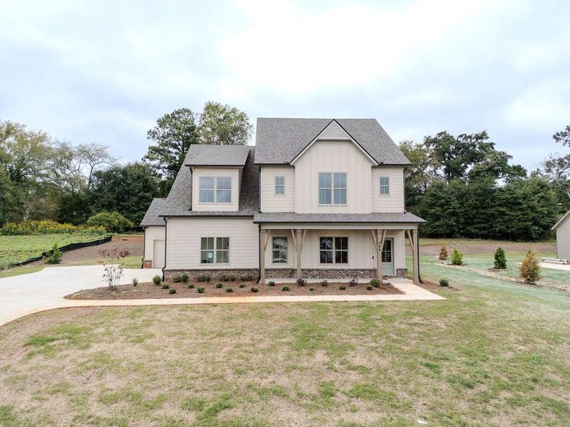 Front exterior of a new home in , Hoschton, GA, highlighting curb appeal (Image 25).