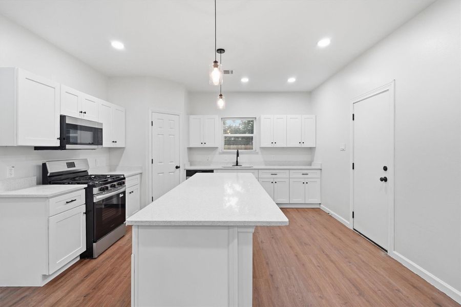Texas sized island offers additional counter and storage space