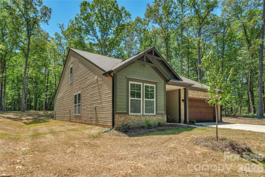 Front exterior of a new home in , Monroe, NC, highlighting curb appeal (Image 22).