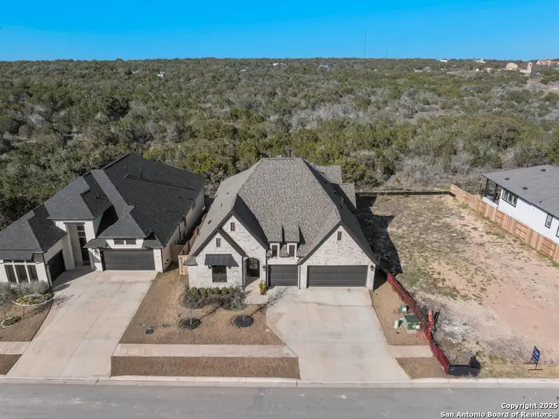 Front exterior of a new home in La Cima 60', San Marcos, TX, highlighting curb appeal (Image 1).