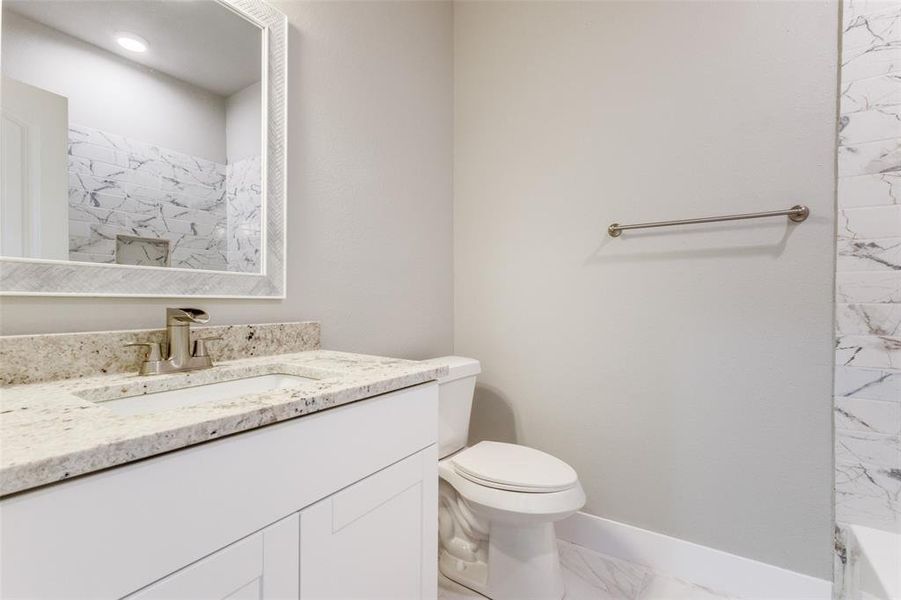 Bathroom featuring toilet and vanity