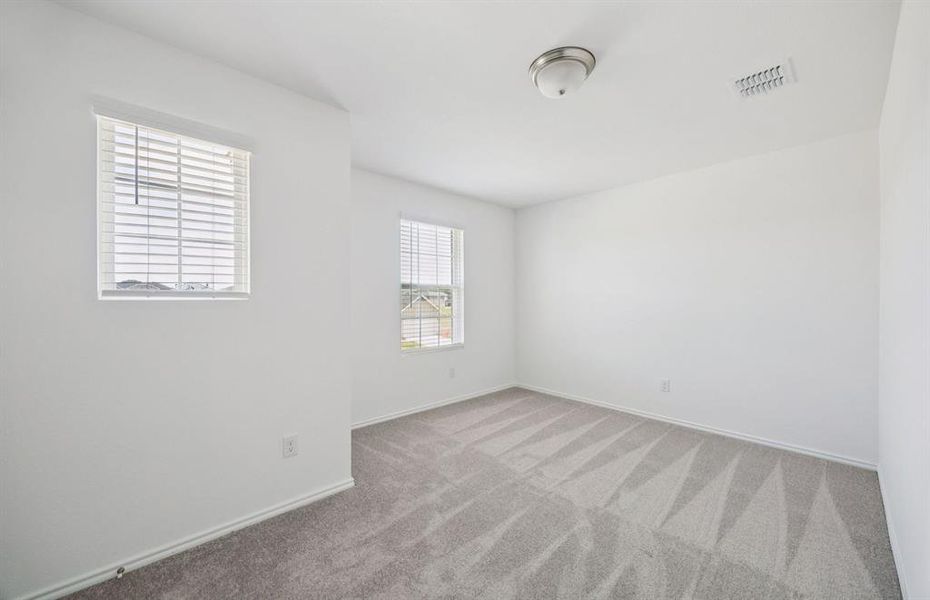 Spacious secondary bedroom with large windows Spacious secondary bedroom with large windows