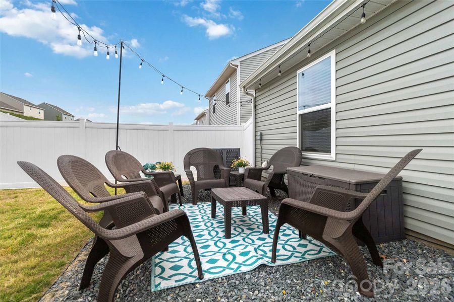 Exterior details and patio area of a home in McKee Creek Village, Charlotte (Image 25).