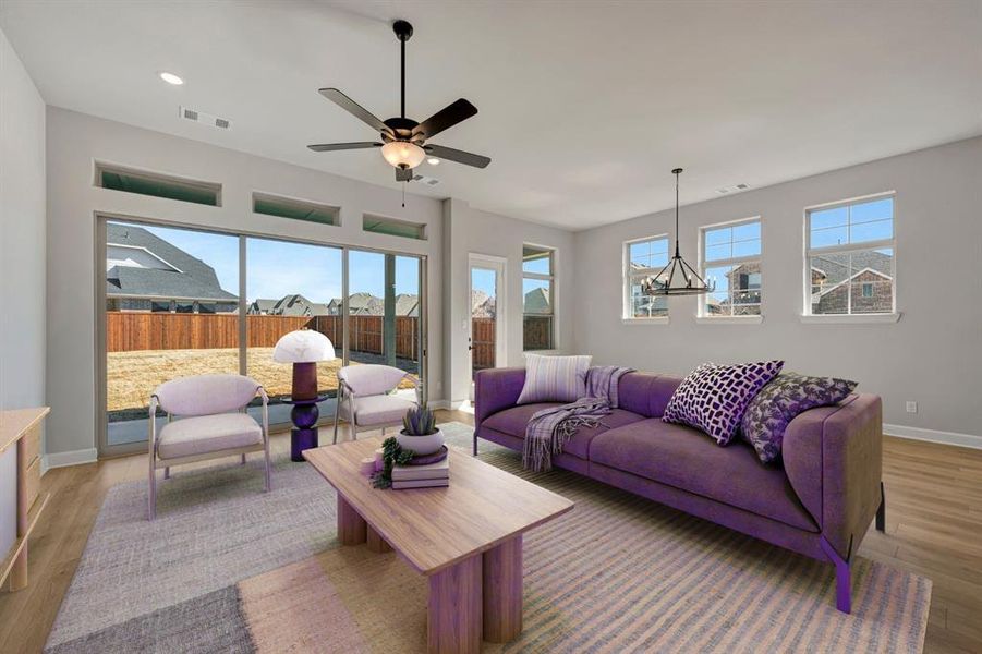 Living area featuring light wood-type flooring, recessed lighting, and ceiling fan
