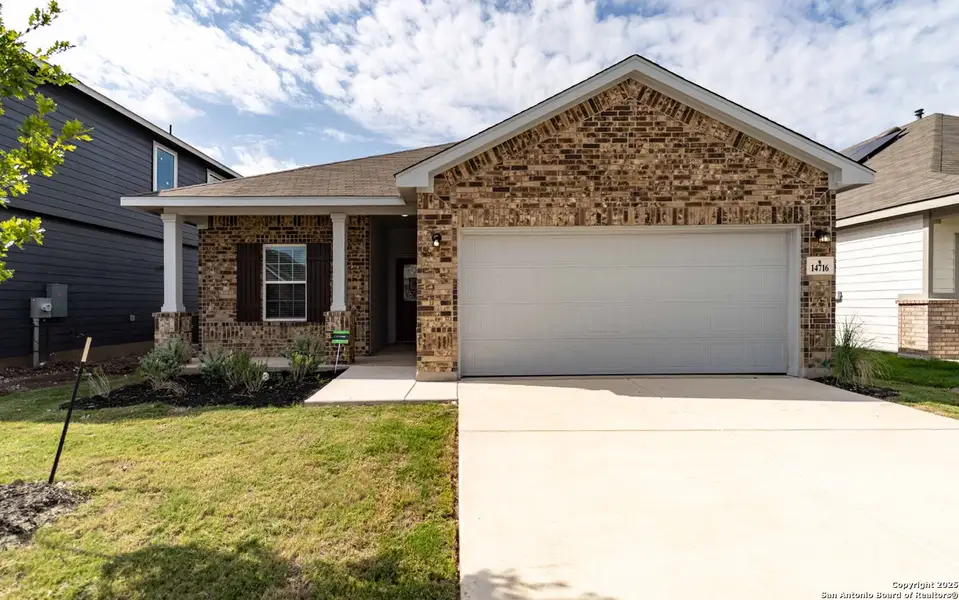 Front exterior of a new home in Hennersby Hollow, San Antonio, TX, highlighting curb appeal (Image 1). Front exterior of a new home in Hennersby Hollow, San Antonio, TX, highlighting curb appeal (Image 1).