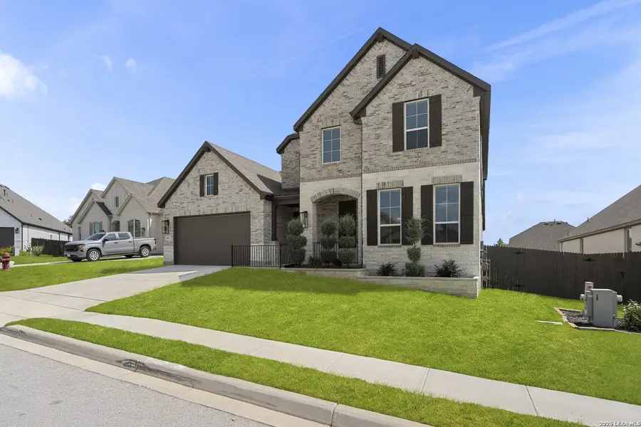 Front exterior of a new home in Ventana, Bulverde, TX, highlighting curb appeal (Image 2). Front exterior of a new home in Ventana, Bulverde, TX, highlighting curb appeal (Image 2).