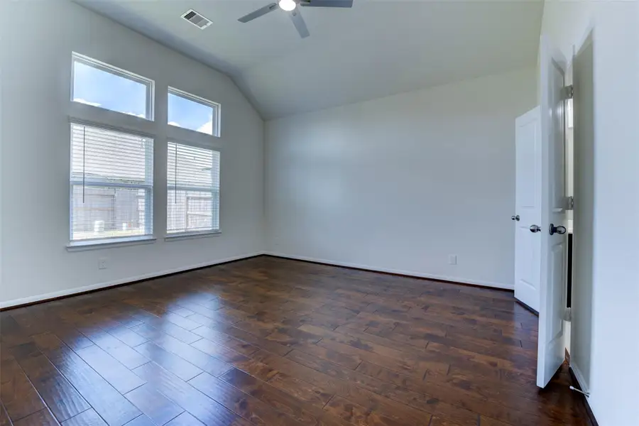 Spacious, unfurnished interior of a new home in Sunterra, Katy (Image 26).