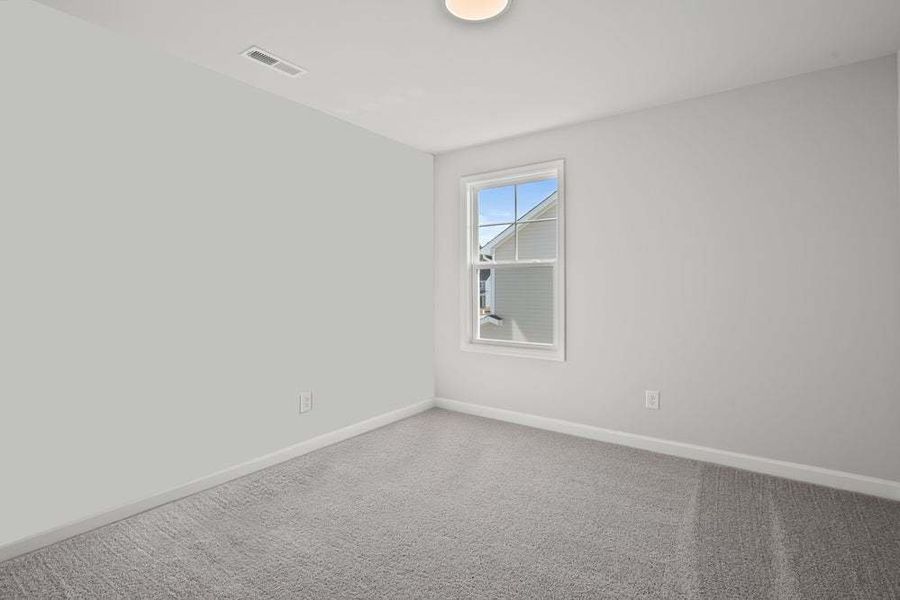 Representative unfurnished interior of a home built from the Camellia by Caviness & Cates Communities in Bartlett Manor, Youngsville (Image 57).