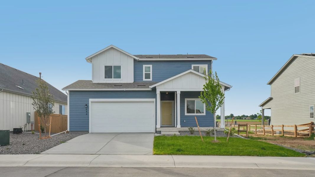 Front exterior of a new home in Granary, Johnstown, CO, highlighting curb appeal (Image 21).