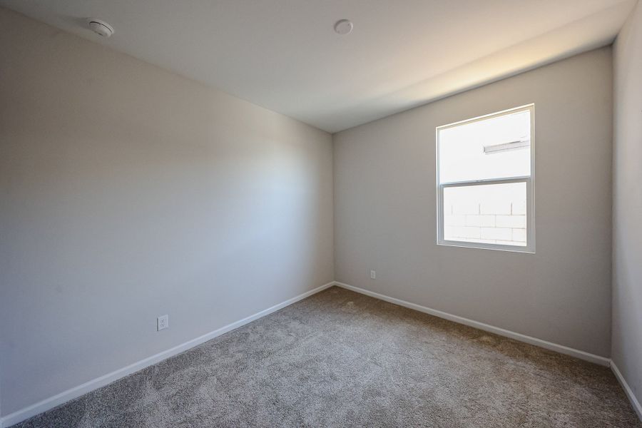 A room with a white wall and a white door. A room with a white wall and a white door.