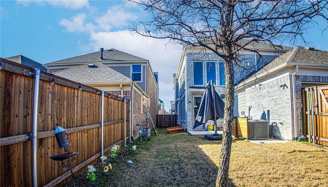 Fenced backyard featuring a patio area