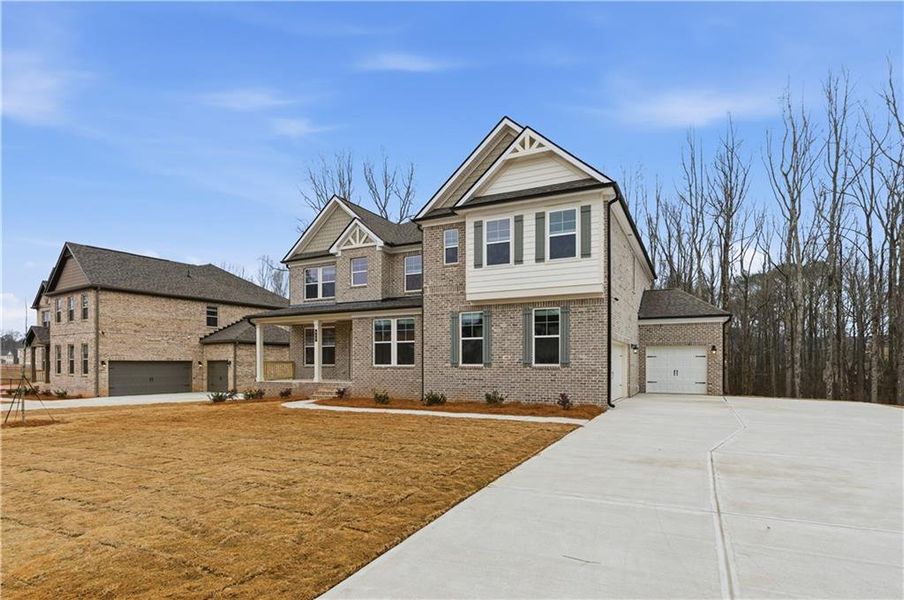 Front exterior of a new home in Trinity Park, McDonough, GA, highlighting curb appeal (Image 18).