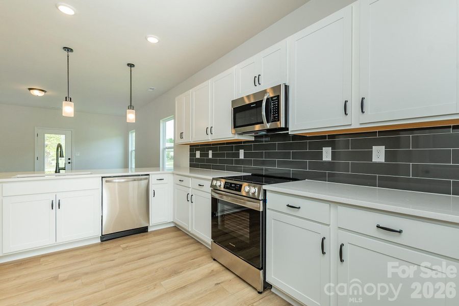 Furnished interior view inside a new home in Country Club Village, Salisbury (Image 5).