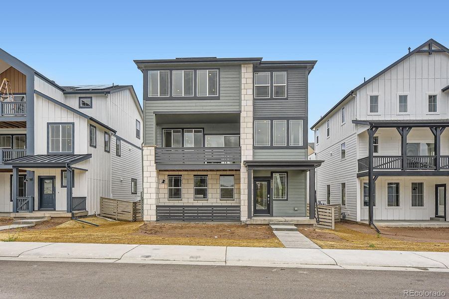 Front exterior of a new home in Sterling Ranch: The Skyline Collection, Littleton, CO, highlighting curb appeal (Image 1).