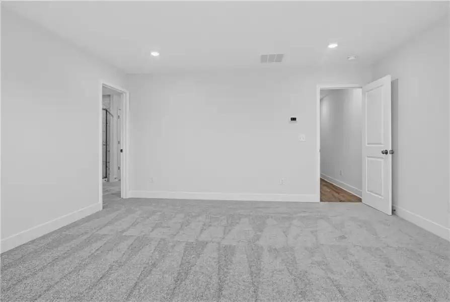Spacious, unfurnished interior of a new home in Towns at Holly Springs, Holly Springs (Image 28). Spacious, unfurnished interior of a new home in Towns at Holly Springs, Holly Springs (Image 28).