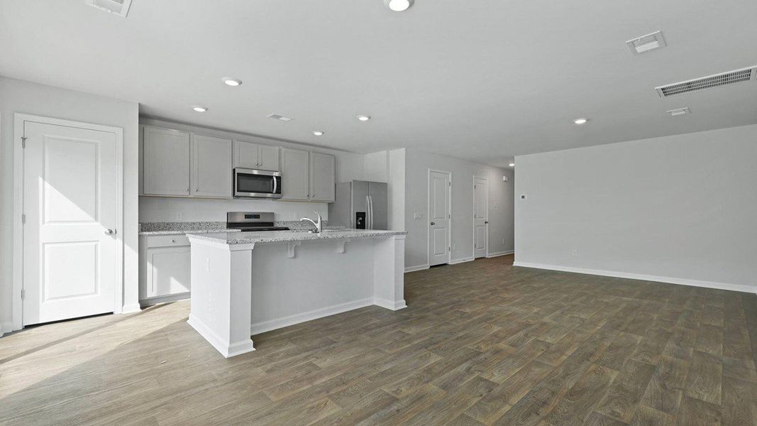 Furnished interior view inside a new home in Pine Hills Townhomes at Cane Bay, Summerville (Image 9).