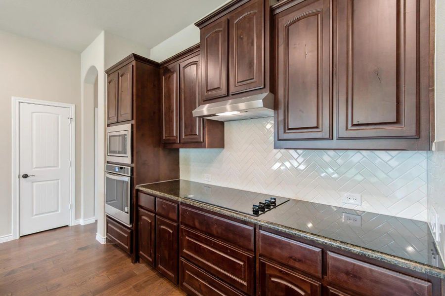 Kitchen | Concept 2671 at Mockingbird Hills in Joshua, TX by Landsea Homes