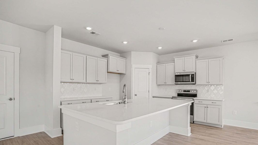 Representative furnished interior of a home built from the Mackenzie2 by D.R. Horton in Chapman Village, Conway (Image 4).