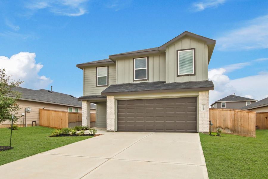 Front exterior of a new home in Mill Creek, Magnolia, TX, highlighting curb appeal (Image 15). Front exterior of a new home in Mill Creek, Magnolia, TX, highlighting curb appeal (Image 15).