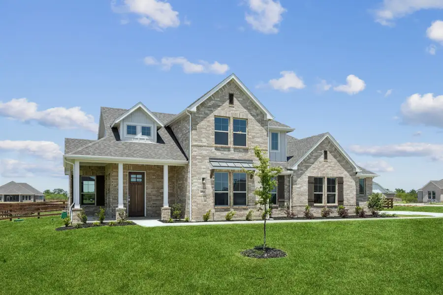 Front exterior of a new home in Ellis Ranch Estates, Waxahachie, TX, highlighting curb appeal (Image 2).