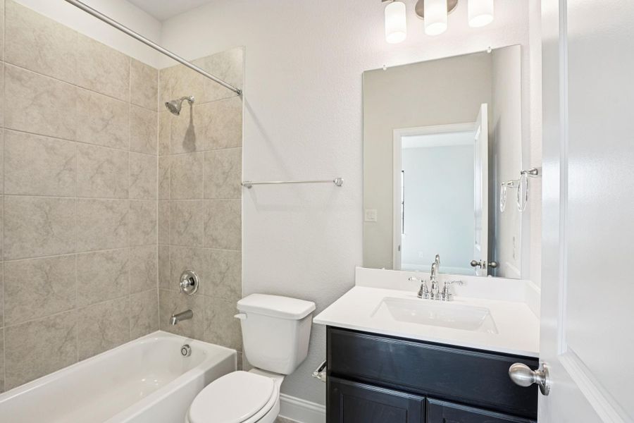 Furnished interior view inside a new home in Del Bello Lakes 60', Manvel (Image 14).