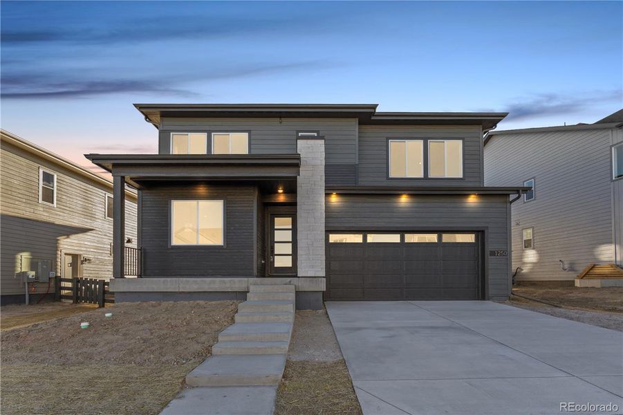 Exterior details and patio area of a home in Portrait at The Canyons, Castle Pines (Image 1).