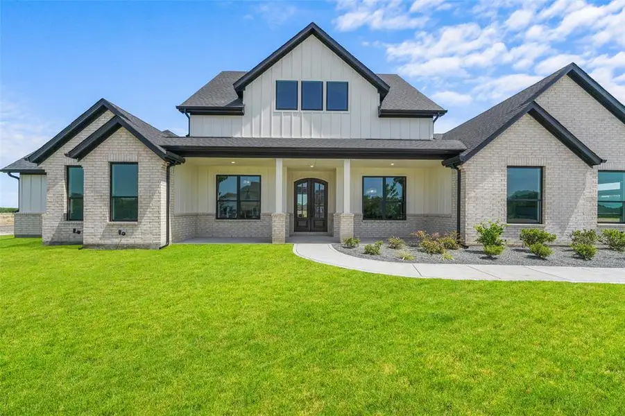 Front exterior of a new home in , Caddo Mills, TX, highlighting curb appeal (Image 25).