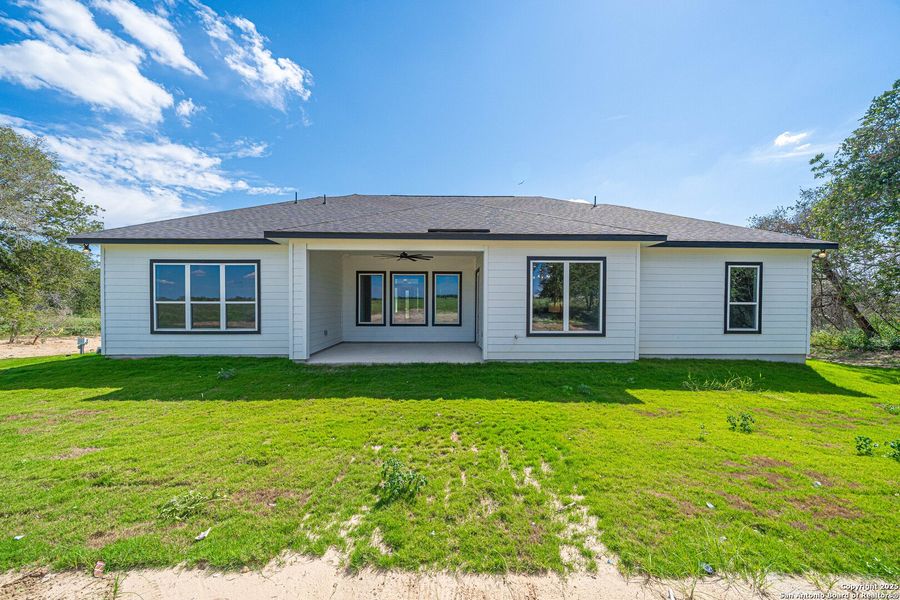 Front exterior of a new home in , Floresville, TX, highlighting curb appeal (Image 16). Front exterior of a new home in , Floresville, TX, highlighting curb appeal (Image 16).
