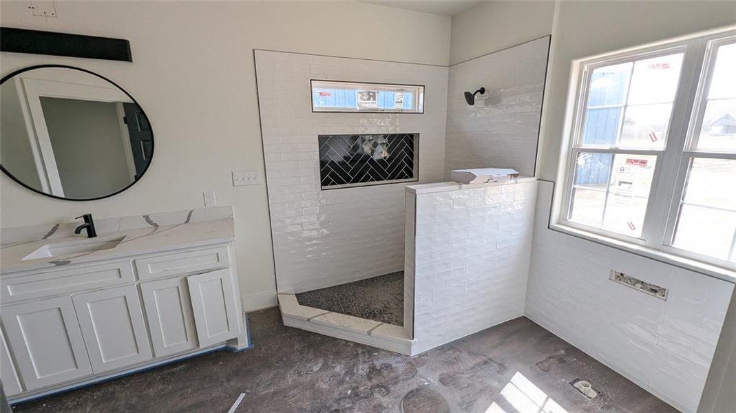 Bathroom featuring vanity and walk in shower